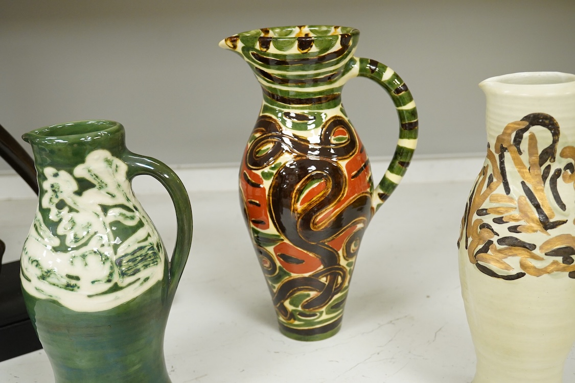 Nicola Tassie (b.1960), Three jugs and a slipware bowl, each signed to the bases, largest 28cm high